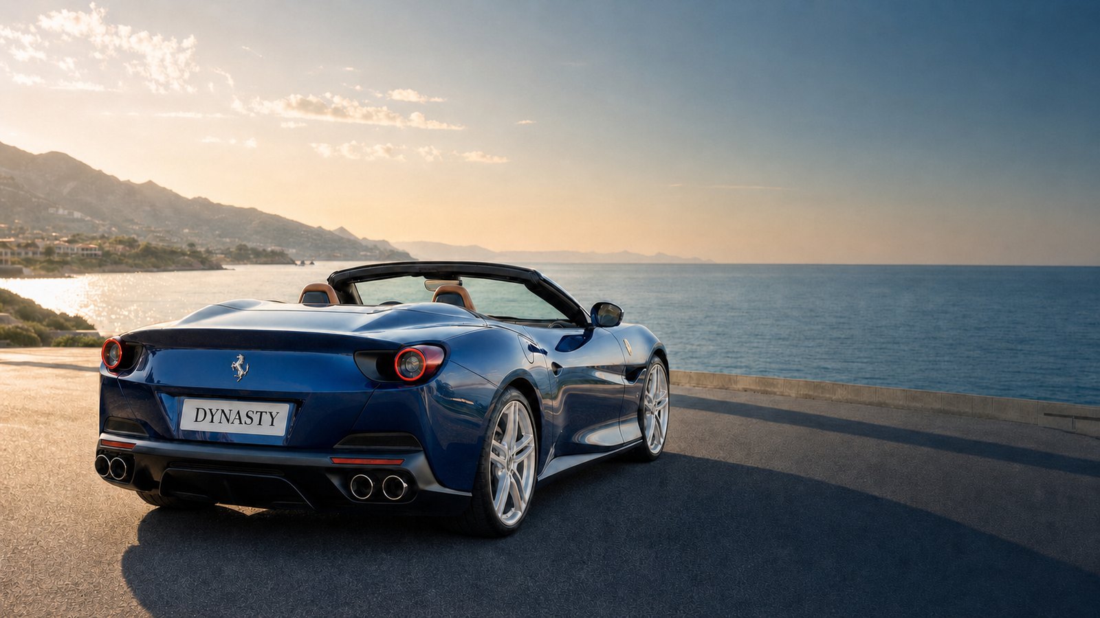 Blue convertible on a coastal road with a DYNASTY vanity license plate.